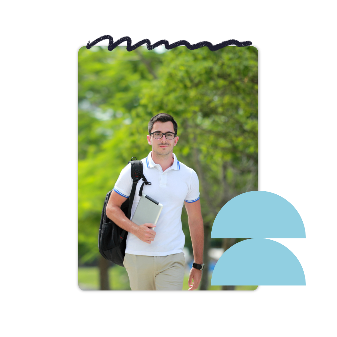 Male college student walking to class