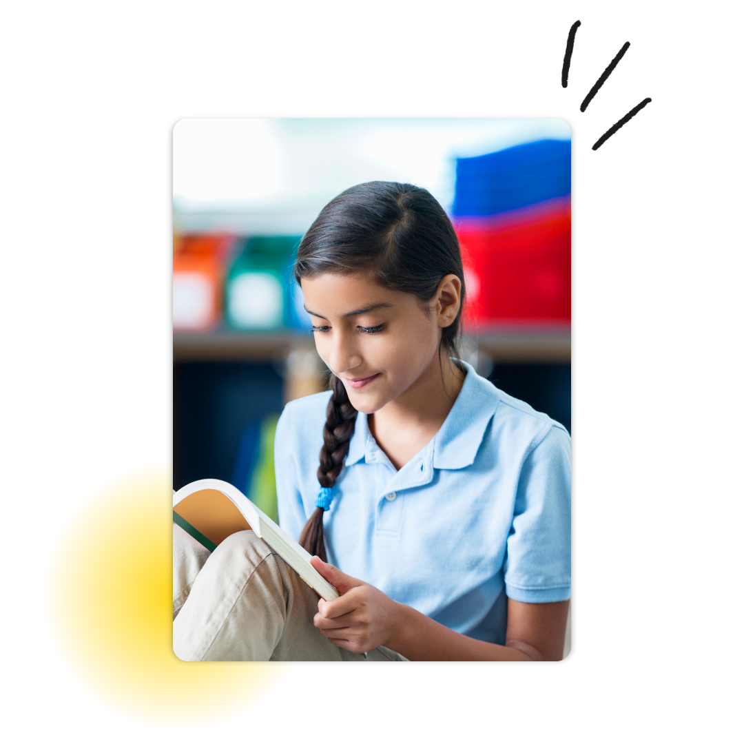 Young female student reading a book